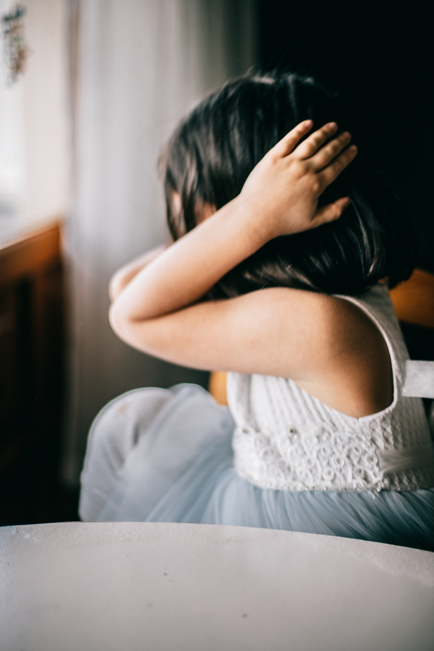 Depressed Young Girl covering her Ears